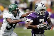 Kansas State running back Parrish Fsher, right, is forced out of bounds by North Texas defender Ja'Mel Branch. Fisher and the Wildcats routed the Mean Green, 54-7, Saturday in Manhattan, showing they could contend this season for the Big 12 North title.