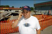 Angel Alvarez, shown on the phone in business discussions, plans to relocate his restaurant, Tortas Jalisco, following an accident at its former location, the Miller Mart, 3300 W. Sixth St.
