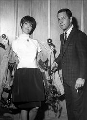 Barbara Feldon and Don Adams, co-stars of the spy spoof show "Get Smart," expose the arsenal of weapons and gimmicks in her coat lining in Los Angeles on Sept. 10, 1965. Adams died of a lung infection late Sunday at Cedars-Sinai Medical Center in Los Angeles, his friend and former agent Bruce Tufeld said Monday. He was 82.