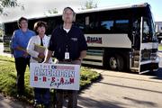 Alan Cobb, right, state director of the Kansas chapter of Americans for Prosperity, talks to people gathered at the Statehouse in Topeka on Tuesday to kick off "The American Dream Express" bus tour in support of the Taxpayer&squot;s Bill of Rights.