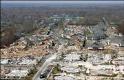 Empty foundations and destroyed homes litter the Gulf Coast on Sept. 13 in Gulfport, Miss., in the wake of Hurricane Katrina. Victims who lost their homes face a difficult task rebuilding amid a shortage of manpower and materials.
