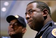 Acting New Orleans Police Supt. Warren Riley listens Thursday to questions about allegations of police misconduct after Hurricane Katrina. At left is Capt. Marlon De Fillo, a police spokesman.