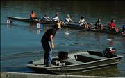 The Kansas University women's crew team launches into the Kansas River on Thursday for a practice session near Burcham Park. The U.S. Geological Survey recently issued a report on pollution in the Kansas River.
