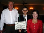 From left, Bo Harris, Dan Sabatini and Betty Morris celebrate receiving the Lawrence Board of Realtors' annual Architectural Enhancement Award for the Hobbs Taylor Lofts project in downtown Lawrence. Harris is chief executive officer and chairman of Harris Construction Co. Inc., which is developing the building at the northeast corner of Eighth and New Hampshire streets. Sabatini, of Sabatini Architects Inc., is project designer; and Morris, a Realtor for Stephens Real Estate, is marketing the project. They were honored during a ceremony Sept. 20 at Lawrence Country Club.
