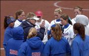 KU softball coach Tracy Bunge talks to the team after the Nebraska Cornhuskers scored five runs in the fifth inning of a spring game.