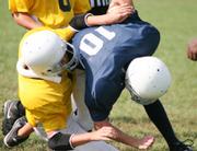 Grizzly Cody Oller is tackled as he attempts to convert on a third down play Sunday at Youth Sports Inc. Southwest took the game over South 20-0 and sole first place of the seventh-grade division. Oller has his hand in two touchdowns.