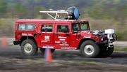 Carnegie Mellon University's H1ghlander robot runs through a test course in Hazelwood, Pa., in this May 5 file photo. The driverless Hummer snagged the pole position Wednesday in a government-sponsored race across the Mojave Desert.