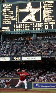 Houston's Roger Clemens delivers a pitch in the top of the 18th inning against the Braves in the deciding Game Four of the National League Division Series. Houston won, 7-6 in 18 innings, Sunday in Houston.