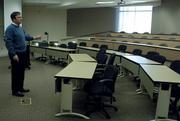 Kansas University Edwards Campus Vice Chancellor Bob Clark walks through a classroom in Regnier Hall, a recent addition to the campus in Johnson County. Clark discussed the future and goals of the campus Friday afternoon.