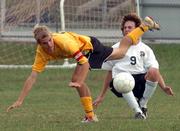 Free State's Andrew Heck (9) avoids a wayward kick by Shawnee Mission West's Eric Potter. Free State won Tuesday's game, 2-0, at FSHS.