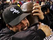 Chicago White Sox manager Ozzie Guillen, left, hugs pitcher Jose Contreras as they celebrate after winning the American League pennant. The White Sox beat the Los Angeles Angels, 6-3, Sunday in Anaheim, Calif., and clinched a spot in the World Series.