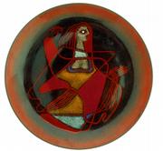 An enameled abstract design of a woman on a red background decorates this tray-shaped piece of copper. It&squot;s signed "Ellamarie & Jackson Wooley, California." It sold recently for $200.