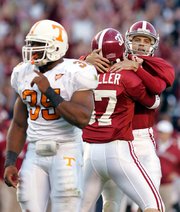 Alabama kicker Jamie Christensen, right, celebrates his game-winning kick with holder Matt Miller in front of Tennessee's Jason Mitchell. Alabama won, 6-3, Saturday in Tuscaloosa, Ala.