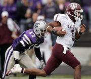 Texas A&M quarterback Reggie McNeal (1) gets past Kansas State safety Maurice Porter for a touchdown. The Aggies beat the Wildcats, 30-28, Saturday in Manhattan.