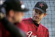 Houston Astros pitcher Roy Oswalt watches teammate Brandon Backe take batting practice. Oswalt is scheduled to start Game 3 of the World Series against the Chicago White Sox in Houston. Chicago leads the series, 2-0.