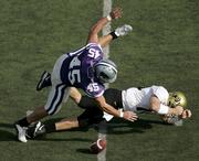 Kansas State linebacker Ted Sims (45) falls on the ball after forcing Colorado quarterback Joel Klatt to fumble in the second quarter. The Buffaloes held off the Wildcats, 23-20, Saturday in Manhattan, giving CU the outright lead in the Big 12 North race.