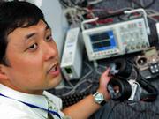 Taro Maeda, senior research scientist at the Nippon Telegraph and Telephone Corp. research center in Atsugi, near Tokyo, works with equipment used as a remote control for humans.