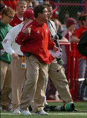 Nebraska coach Bill Callahan finishes a throat-slashing gesture during Nebraska's game with Oklahoma. Callahan was slapped by the Big 12 Conference for the gesture, which he made Saturday in a 31-24 loss to Oklahoma in Lincoln, Neb.
