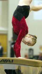 Lawrence High's Abby Jones pushes off on her vault during state competition. Jones finished fifth in the event at Saturday's meet with a score of 9.25.