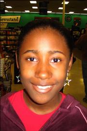 <strong>Jamesha Flanagan, Schwegler School, sixth grade</strong><br/>
<em>"A whole bunch of CDs, my headphones and some books."</em>