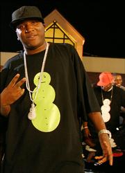 Rapper Young Jeezy gestures while wearing a T-shirt printed with his trademark snowman. Kids and retailers say the snowman symbolizes the white substance colloquially called snow: cocaine.