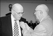 Benjamin Shore, left, receives a pin from John Diehl during a ceremony Oct. 10. Both were honored for serving 60 years as Masons by Lawrence Lodge No. 6.
