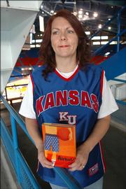 In Lisa Harkrader&squot;s latest book, "Airball," a seventh-grader plots to meet a KU-turned-NBA basketball player who he believes is his father. The Tonganoxie author wrote the book under the pseudonym L.D. Harkrader.