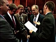 Former Shawnee County District Judge Eric Rosen, center, talks with his four sons, from left, Jacob, Mark, Tom and Paul, before being sworn in Friday as the newest justice on the Kansas Supreme Court at the Kansas Judicial Center in Topeka.