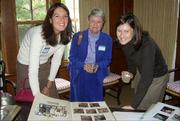 From left, Anne Murray, Tammy Steeples and Emily Yeretsky, members of Lawrence Kappa Kappa Gamma Alumni Assn., view scrapbooks during the Fraternity's Founder's Day celebration on Oct. 22.