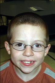<strong>Corey Mann, first grade, Quail Run School</strong><br/>
<em>"We play checkers and chess. Sometimes we like to play dodgeball."</em>