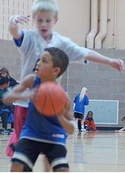 Jayhawks guard Sam Dykes, left, attempts to block the shot of Team 3 guard Daonte Lowery, right, Saturday at the East Lawrence Center.