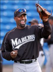 Florida's Carlos Delgado plays catch in this April 1 photo in Port St. Lucie, Fla. Delgado was traded to the New York Mets on Thursday.