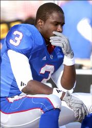 Former Kansas University standout Charles Gordon sits on the Jayhawk bench during a game last season. Gordon, Nick Reid and Charlton Keith are hoping to be tapped in this weekend's NFL Draft, and recruiting analyst Dan Shonka said one of the three could be tapped 'Mr. Irrelevant' with the last pick.