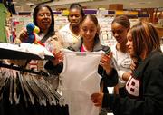 Delta Sigma Theta members, from left, Jennifer King, Danica Moore, Yana Delkhah, Marie Hampton and Ragan Foreman, browse Kansas University gear at the Jayhawk Bookstore. The sorority raises money for different causes, including an upcoming project to benefit AIDS research.