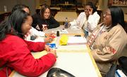 Delta Sigma Theta members, from left, Marina Barton, Ragan Foreman, Danica Moore and Jennifer King, talk about their upcoming 2005 Red Carpet Affair AIDS Banquet.