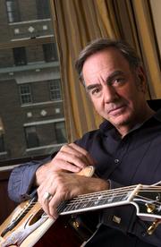 Singer Neil Diamond, 64, has returned with "12 Songs," a back-to-basics disc produced by musical guru Rick Rubin. His work debuted at a personal-best No. 4 on the Billboard album chart.