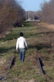 A city committee has recommended that an abandoned rail line in East Lawrence should become a 10-foot wide hike/bike trail surrounded by native plants and grasses. A hiker recently followed the tracks north from 23rd Street.