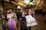 The King family, from left, Austin, 6, Kathy, 9, Jennifer, 20, Brittany, 19, and mom Lynette shop Friday in Spartanburg, S.C.