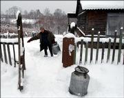 A native Nanai boy carries water jugs Saturday from his home in Sikachi-Alyan, Russia. The native peoples of Russia's Far East are among the most endangered by the imminent arrival of a toxic slick released by an industrial accident in China.