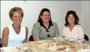 City employees, from left, Renee Stains, Sandy Day and Rachel Palmer sell baked goods at the Oct. 19 annual city picnic. Proceeds benefited the United Way of Douglas County's fall campaign.