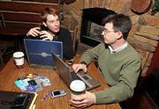 Jon Vernon, left, and Bob Butler launched CardAvenue.com for users to buy, sell or trade their unwanted gift cards. They meet regularly at Kayak's Coffee House in St. Louis to discuss their Web site.