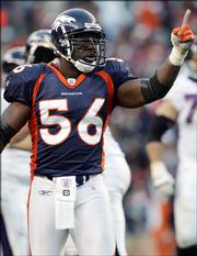 Denver's Al Wilson celebrates after the Broncos recovered a Baltimore fumble. The Broncos won, 12-10, Sunday in Denver.