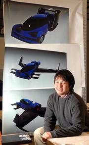 Yasuhiro Homma and a team of Kansas University students have been working on designs for a flying car. Homma, the team leader, displays computer renderings of the car, with wings retracted, at top, for driving, and with the wings extended, middle and bottom, for flying.