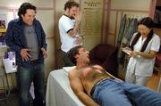 Actor Steve Carell screams during a chest wax in "The 40-Year-Old Virgin." Miki Mia, right, a full-time actress who helps in her aunt&squot;s waxing salon when she returns to her native Japan, was perfect for the role. Watching are actors Paul Rudd, left, and Seth Rogen.