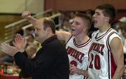 Stephen Vinson, right, and D.J. Watkins, center, cheer with LHS coach Chris Davis from the LHS bench in a file photo from the 2001-02 season.