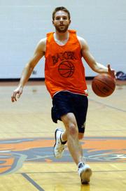 Former Lawrence High standout D.J. Watkins brings the ball upcourt during a recent Baker practice. Watkins says not making the cut for Kansas University's team as a walk-on was a blessing in disguise that helped him land in Baldwin.