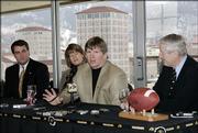Colorado coach Dan Hawkins, second from right, predicted that his team would win 10 games in 2009, but sports books aren't as optimistic about the Buffaloes.