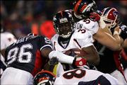 Buffalo's Jeff Posey (96) tackles Denver's Mike Anderson in the first quarter of the Broncos' 28-17 victory. Denver won Saturday night in Orchard Park, N.Y.