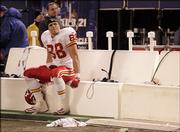 Kansas City tight end Tony Gonzalez glances at the scoreboards after the Chiefs' loss to the Giants.