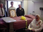 The Scottish Rite Masons dedicate Lawrence Memorial Hospital Palliative Care Room 217 in the memory of George Mole during a ceremony Dec. 4. From left are Danny Keller, assistant representative of the Scottish Rite Masons; Dalton Walsh, great-grandson of George Mole; Tom Wilkerson, executive secretary of the Scottish Rite Masons; and Betty Mole, wife of George Mole.